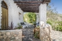 Doors opening to shaded terraces